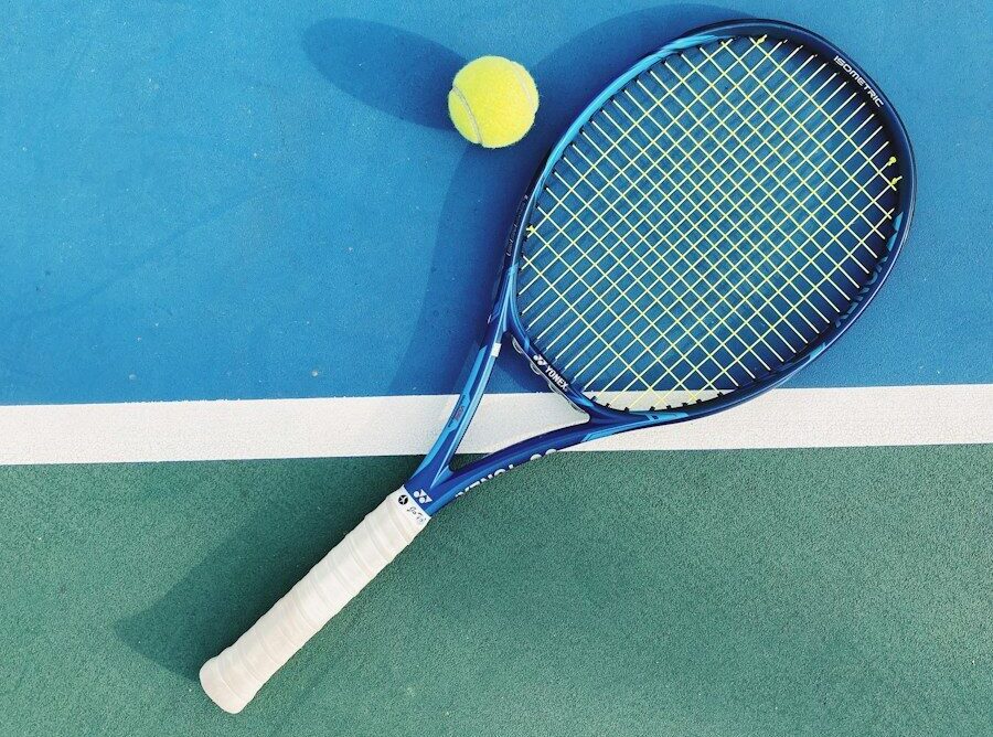 white and blue tennis racket